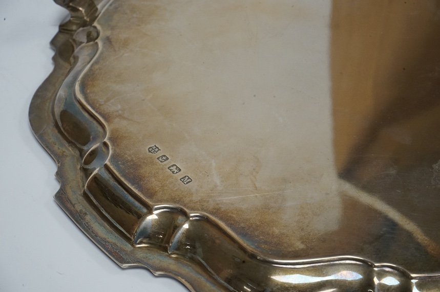 A George VI silver salver, with pie crust border, on three scroll feet, by Barker Brothers Silver Ltd, Birmingham, 1936, 30.7cm, 31.3oz. Condition - fair to good